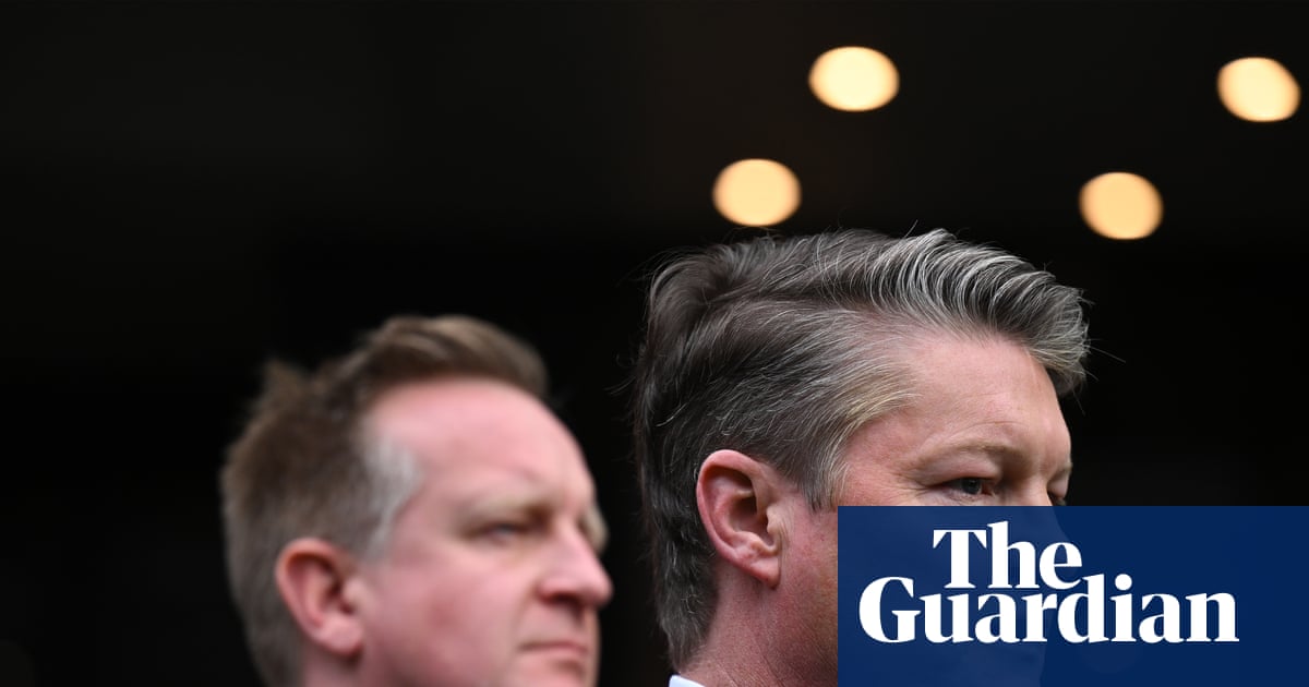 Victorian Premier Ben Carroll speaks at a press conference beside Police Minister Paul Edbrooke